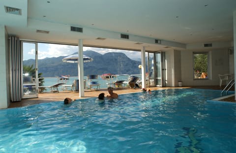 Indoor pool, seasonal outdoor pool, pool umbrellas, sun loungers