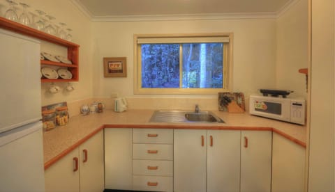 Cottage, 1 Bedroom (rainforest) | Private kitchen | Full-size fridge, microwave, stovetop, coffee/tea maker