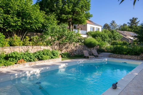 Seasonal outdoor pool, open 8 AM to 7:30 PM, pool umbrellas