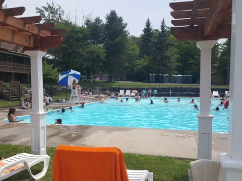 Seasonal outdoor pool, open 11:30 AM to 6:30 PM, lifeguards on site