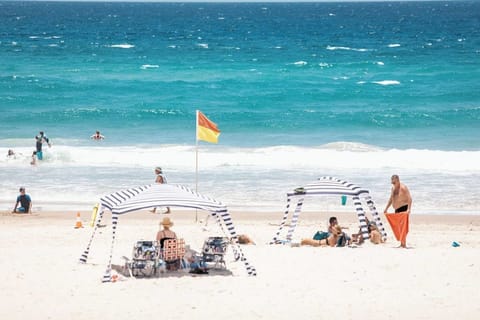 Beach nearby, white sand, beach towels