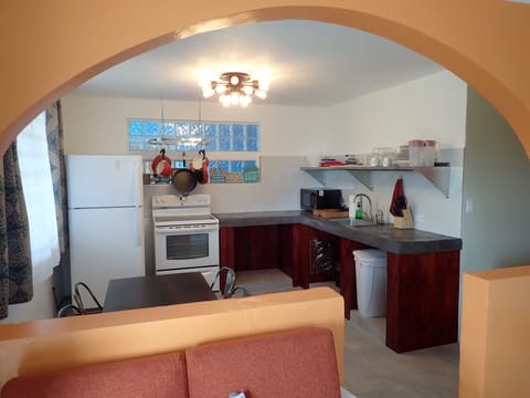 Deluxe Apartment, 2 Bedrooms, Kitchen, Partial Ocean View (Room #6) | Private kitchen | Fridge, microwave