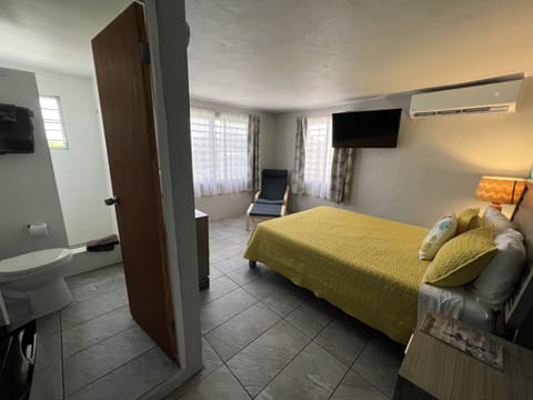 Deluxe Single Room, 1 Queen Bed, Partial Ocean View (Room #11) | In-room safe, blackout drapes, iron/ironing board, free WiFi