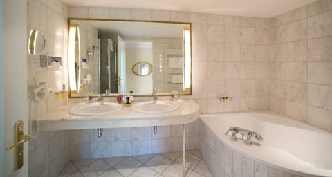 Designer toiletries, hair dryer, bathrobes, slippers