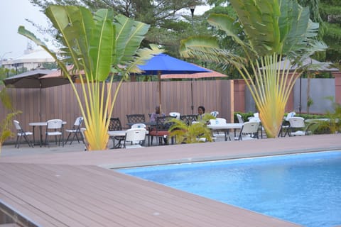 Outdoor pool, open 7 AM to 9:30 PM, pool umbrellas