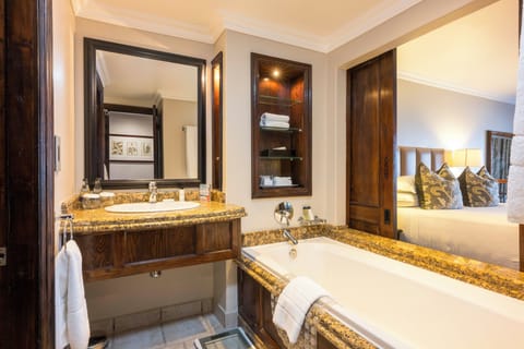 Deluxe Room | Bathroom | Separate tub and shower, designer toiletries, hair dryer, bathrobes