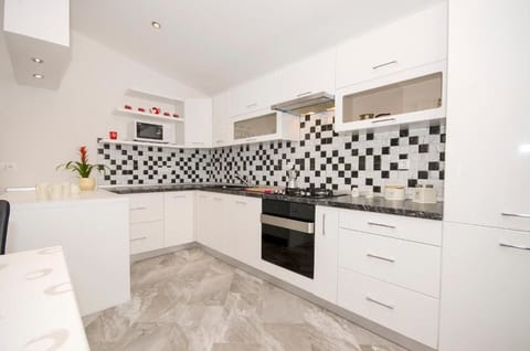 Apartment, 2 Bedrooms, Balcony, Sea View | Private kitchen | Fridge, coffee/tea maker, electric kettle