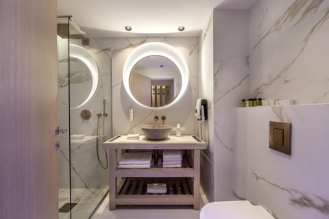 Premium Suite, Partial Sea View | Bathroom | Eco-friendly toiletries, hair dryer, slippers, towels