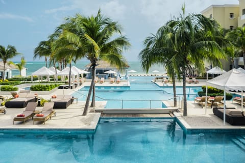 Outdoor pool, free cabanas, pool umbrellas