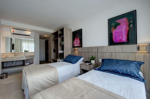 Deluxe Double or Twin Room, Sea View | Minibar, in-room safe, desk, blackout drapes