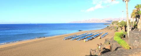 Beach nearby, white sand, sun loungers, beach umbrellas