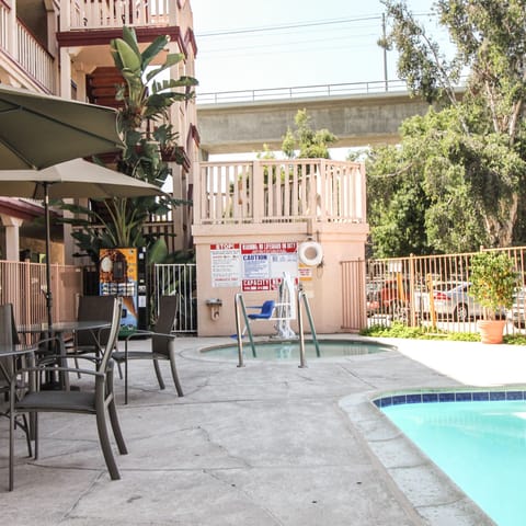 Outdoor pool, pool umbrellas, sun loungers