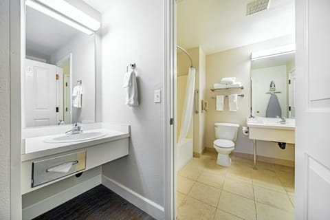 Suite, 1 King Bed | Bathroom | Combined shower/tub, eco-friendly toiletries, hair dryer, towels