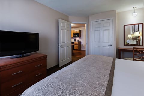 Suite, 1 Bedroom | Desk, blackout drapes, iron/ironing board, free WiFi