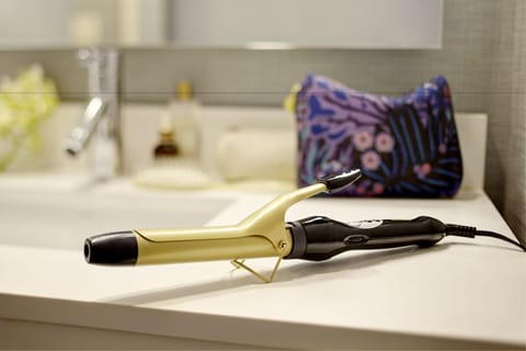 Designer toiletries, hair dryer, towels