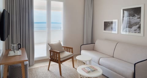 Junior Suite, Balcony, Partial Sea View | In-room safe, desk, free WiFi, bed sheets