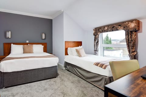 Family Triple Room, Multiple Beds | Individually decorated, individually furnished, desk, laptop workspace