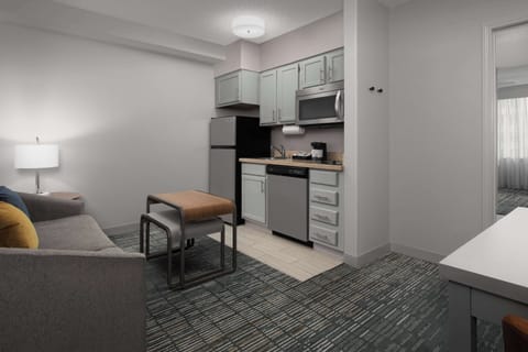 Suite, 1 King Bed | Private kitchen | Fridge, microwave, stovetop, dishwasher