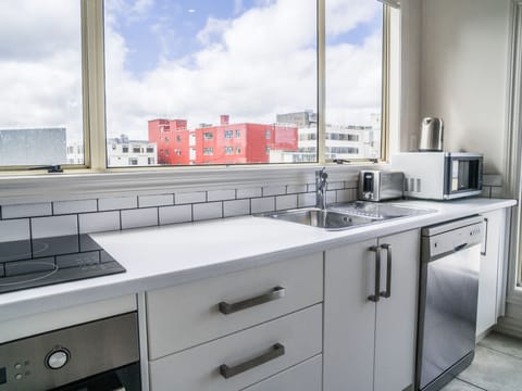 Penthouse, 2 Bedrooms, Balcony (Level 4 - lift access to Level 2 only) | Private kitchenette | Fridge, microwave, stovetop, dishwasher