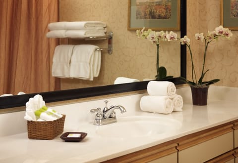 Combined shower/tub, designer toiletries, hair dryer, towels