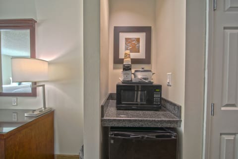 Desk, laptop workspace, blackout drapes, iron/ironing board