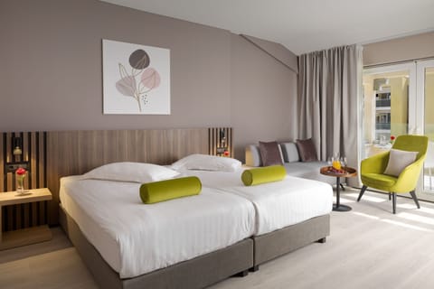 Premium room with balcony pool side | Minibar, in-room safe, desk, free cribs/infant beds