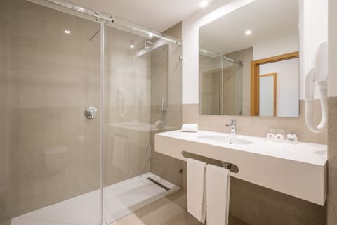 Twin Room, Balcony, Pool View | Bathroom | Shower, rainfall showerhead, soap, shampoo