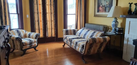 Deluxe Room | Living area | TV, fireplace