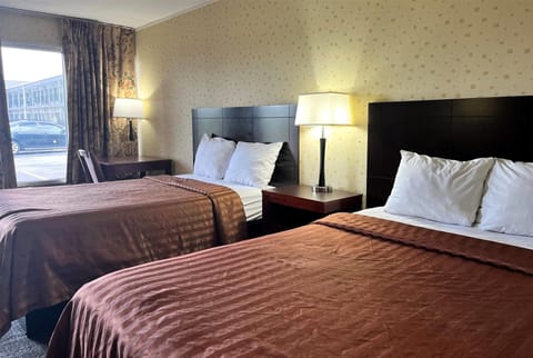 Desk, laptop workspace, blackout drapes, iron/ironing board