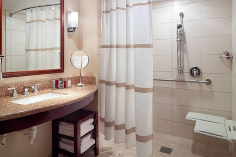 Combined shower/tub, designer toiletries, hair dryer, towels