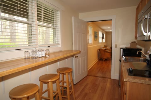 Triple Queen Suite | Private kitchenette | Fridge, coffee/tea maker