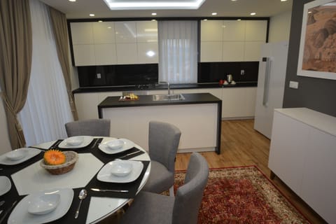 Luxury Apartment, 3 Bedrooms | Private kitchen | Full-size fridge, oven, stovetop, highchair