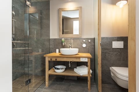 Deluxe Double Room, Non Smoking | Bathroom | Shower, bathrobes, slippers, towels