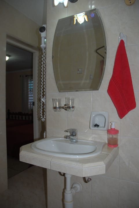 Rainfall showerhead, designer toiletries, hair dryer, heated floors