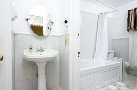 Lawton Suite | Bathroom | Hair dryer, towels, soap, shampoo