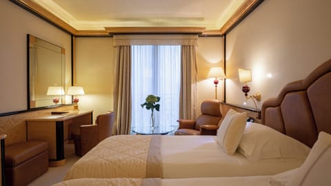 Premium bedding, down comforters, pillowtop beds, minibar