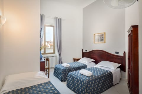 Standard Triple Room | Desk, blackout drapes, soundproofing, iron/ironing board