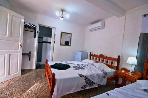 Basic Triple Room, Multiple Beds, Non Smoking | Minibar, iron/ironing board, bed sheets