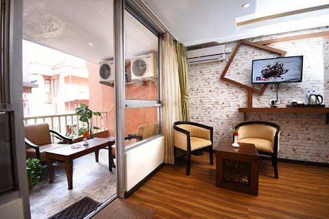 Executive Suite, Balcony (Complimentary Airport Pick-up) | Living area | 32-inch LED TV with cable channels, TV