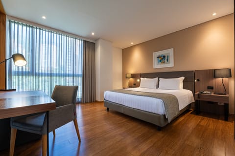 Deluxe Room, Multiple Beds | Premium bedding, in-room safe, desk, laptop workspace