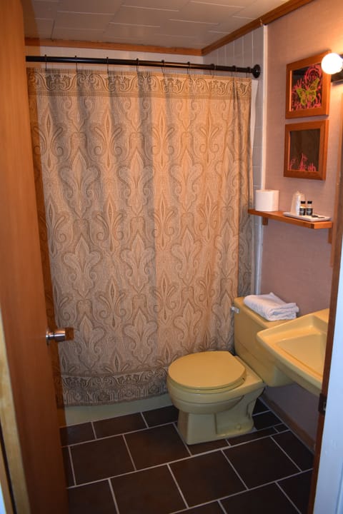 Standard Room, 2 Queen Beds | Bathroom | Combined shower/tub, free toiletries, hair dryer, towels