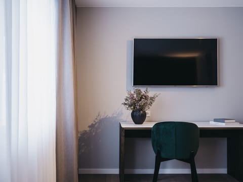 Standard Room | Living area | 32-inch LCD TV with digital channels, TV, books