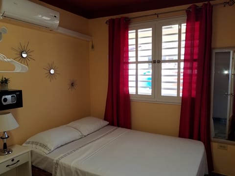 Economy Double Room | Minibar, in-room safe, iron/ironing board, bed sheets