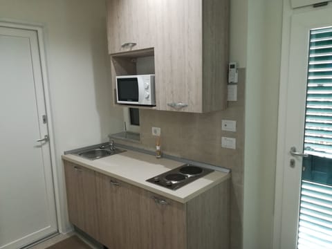 Comfort Studio | Private kitchenette | Full-size fridge, microwave, stovetop, cookware/dishes/utensils