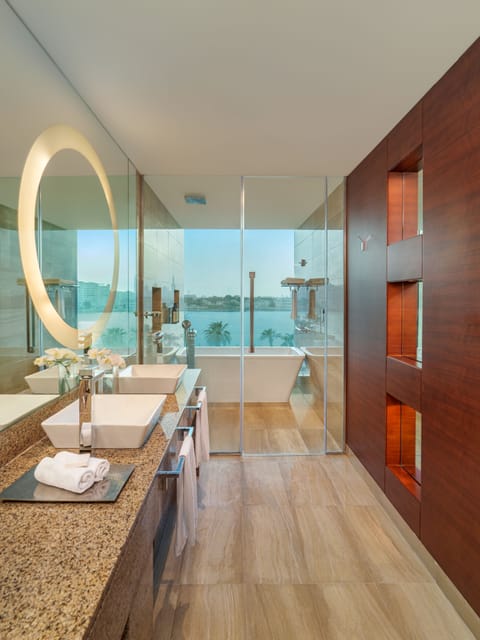 Suite, 1 Bedroom, Kitchen | Bathroom | Combined shower/tub, designer toiletries, hair dryer, bathrobes