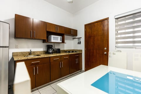 Family Suite, City View | Private kitchen | Full-size fridge, coffee/tea maker