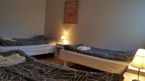 Triple Room, Shared Bathroom | Blackout drapes, free WiFi, bed sheets