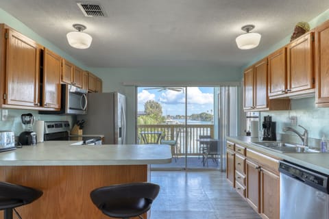 Waterfront Upstairs Suite | Private kitchen | Full-size fridge, microwave, stovetop, coffee/tea maker