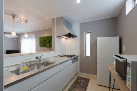 Holiday home | Private kitchen | Fridge, microwave, stovetop, electric kettle