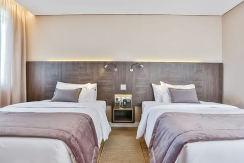 Superior Twin Room | Minibar, in-room safe, desk, soundproofing